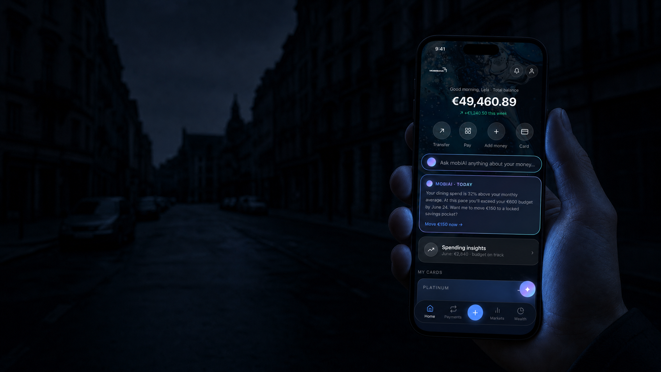 A city street in a total blackout, lit only by the screen of a phone showing the MobiBank app